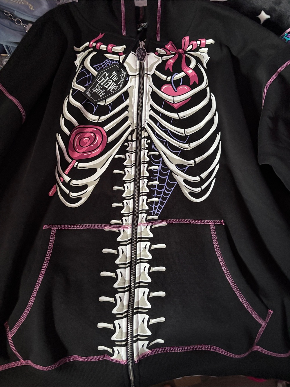 Dolls Kill Black Skeleton Zip-Up Hoodie with Pink & White Graphic